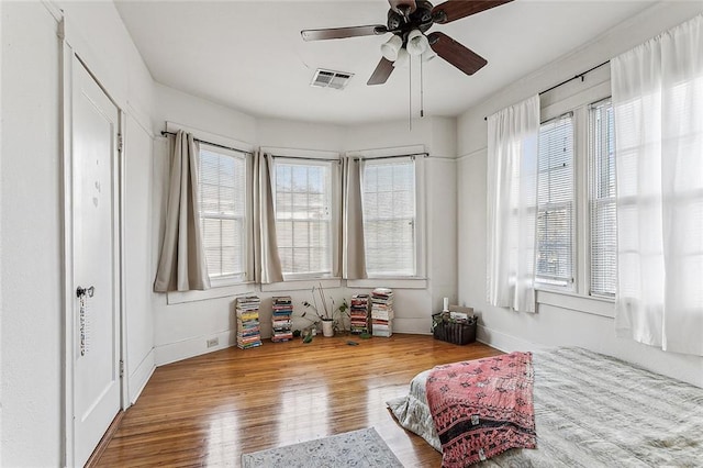 bedroom featuring hardwood / wood-style flooring and ceiling fan