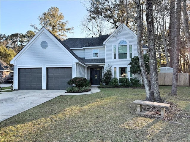 view of front of home featuring a garage and a front yard