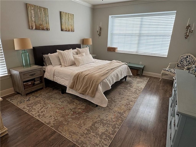 bedroom featuring dark hardwood / wood-style flooring and ornamental molding