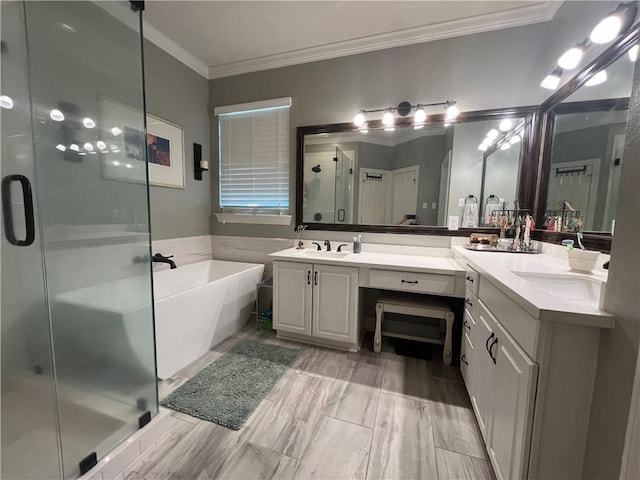 bathroom featuring vanity, separate shower and tub, and crown molding