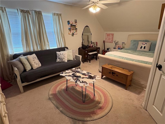 bedroom with ceiling fan, light carpet, and lofted ceiling