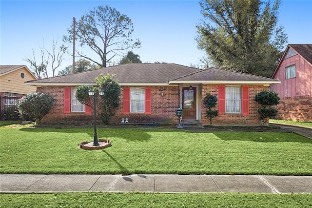 ranch-style home featuring a front yard