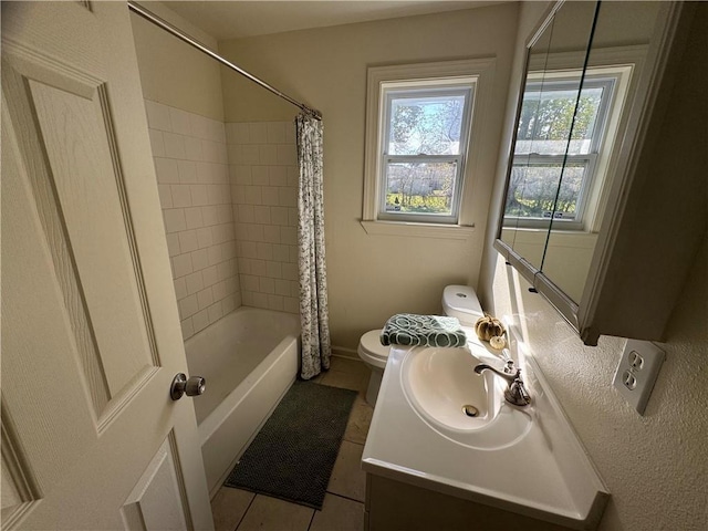 full bathroom with tile patterned floors, vanity, shower / tub combo, and toilet