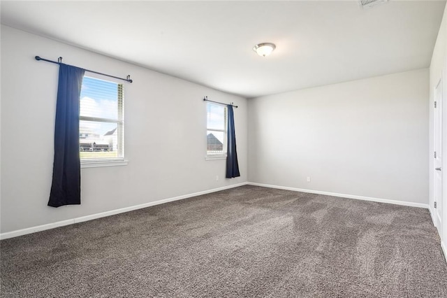 unfurnished room with carpet flooring