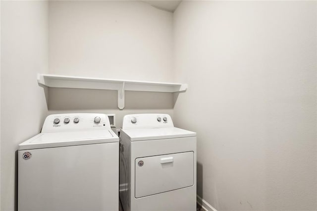 clothes washing area featuring washing machine and dryer