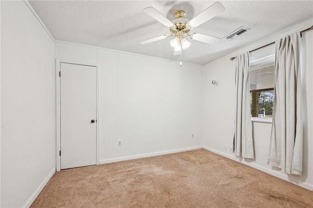 unfurnished room featuring ceiling fan and light colored carpet