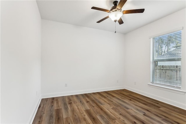 unfurnished room featuring dark hardwood / wood-style flooring and ceiling fan