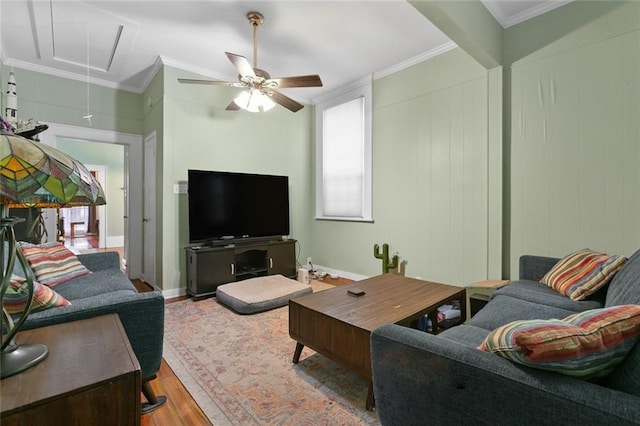 living room with ceiling fan, light wood-type flooring, and crown molding