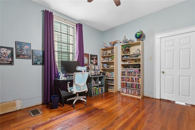 home office featuring hardwood / wood-style floors and ceiling fan