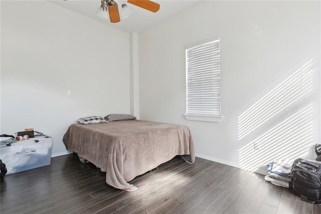 bedroom featuring dark hardwood / wood-style flooring and ceiling fan