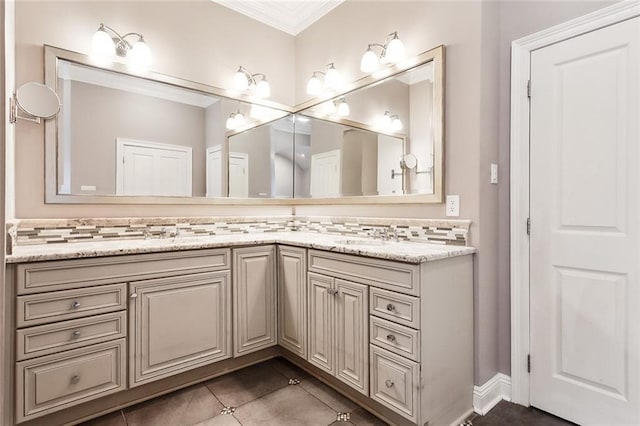 bathroom with tile patterned flooring, vanity, crown molding, and backsplash