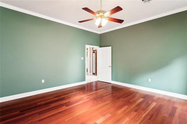 unfurnished room with hardwood / wood-style flooring, ceiling fan, and ornamental molding