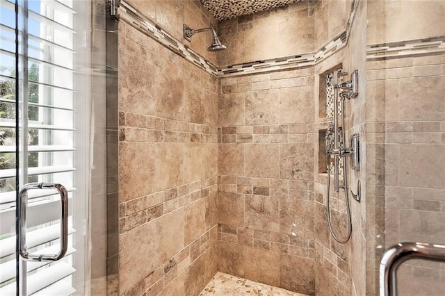 bathroom featuring an enclosed shower