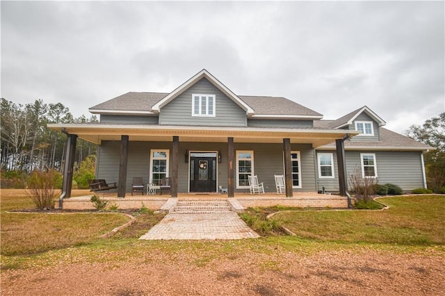 view of front of home featuring a porch and a front lawn