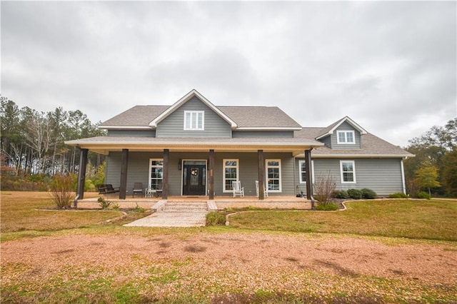 view of front of house with a porch and a front yard