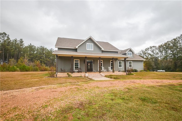 view of front facade with covered porch and a front lawn