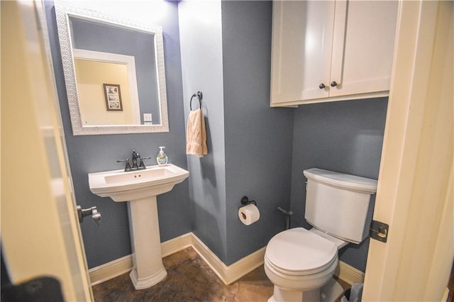 bathroom with toilet and sink