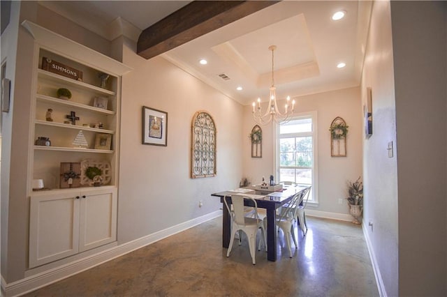 dining area featuring concrete floors, built in features, a tray ceiling, and an inviting chandelier