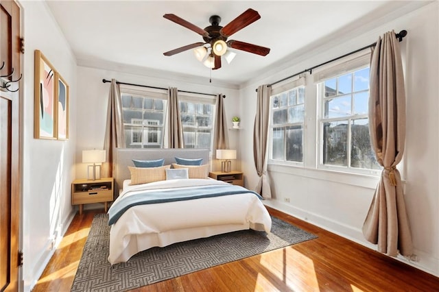 bedroom featuring ceiling fan and hardwood / wood-style floors