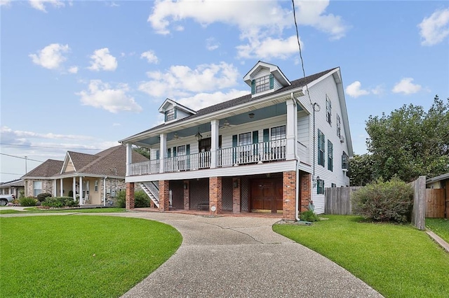 view of front of property with covered porch and a front lawn