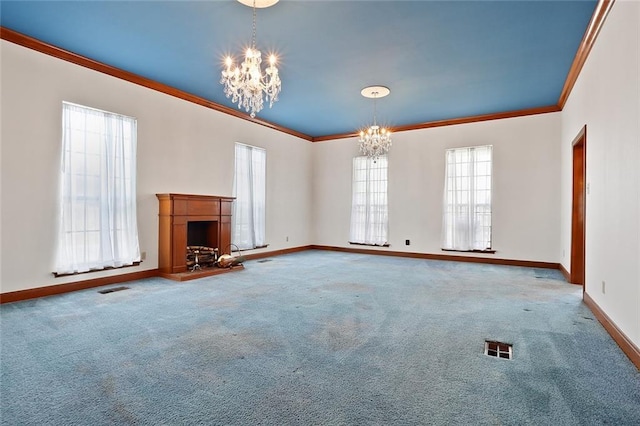 unfurnished living room featuring carpet, an inviting chandelier, and crown molding