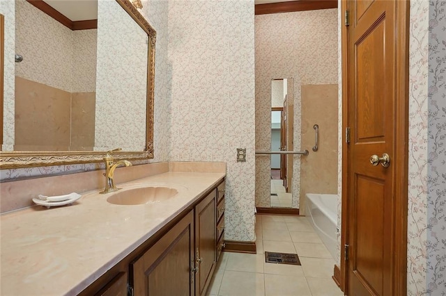 bathroom with tile patterned flooring, vanity, ornamental molding, and a bath