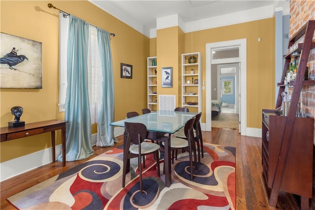 dining area with dark hardwood / wood-style floors