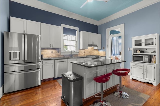 kitchen featuring white cabinetry, sink, and appliances with stainless steel finishes