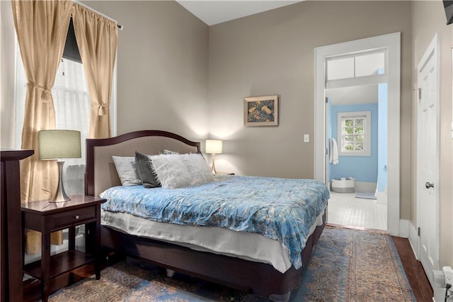 bedroom with dark wood-type flooring