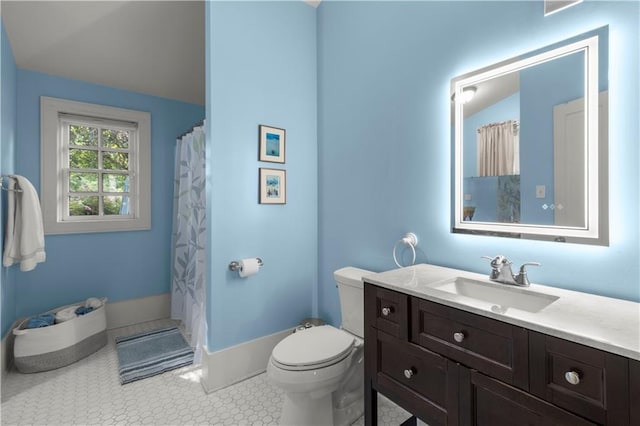 bathroom with vaulted ceiling, tile patterned flooring, vanity, walk in shower, and toilet