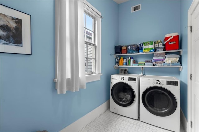 laundry area with washer and clothes dryer