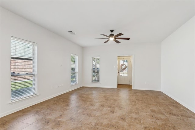 unfurnished room with ceiling fan