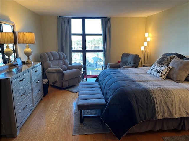 bedroom with light hardwood / wood-style floors