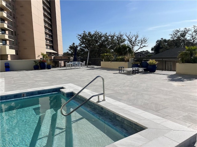 view of swimming pool with a patio