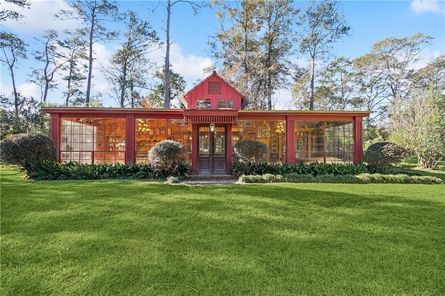 exterior space with a yard and french doors