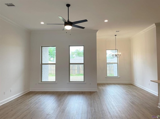 113 Olivia Dr, Luling, LA 70070 - empty room featuring visible vents, a healthy amount of sunlight, ceiling fan with notable chandelier, and wood finished floors