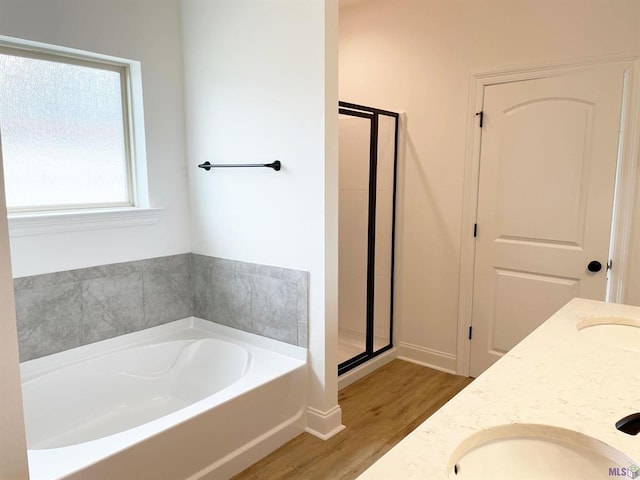 113 Olivia Dr, Luling, LA 70070 - full bath featuring a bath, a sink, a stall shower, double vanity, and wood finished floors