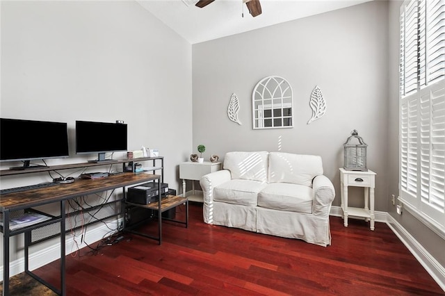 home office with ceiling fan, hardwood / wood-style floors, and vaulted ceiling