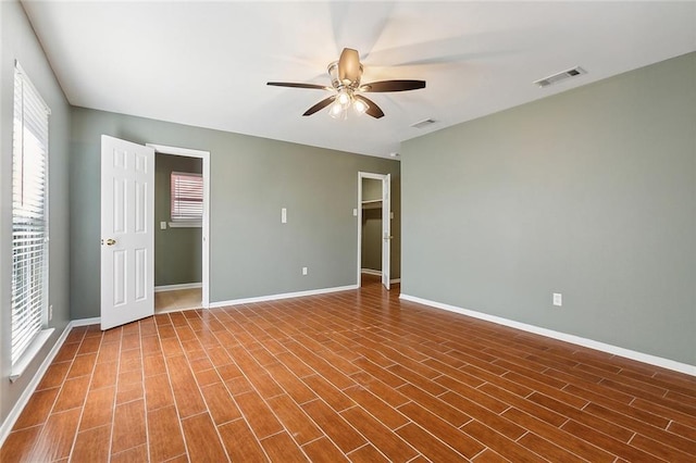 interior space with ceiling fan