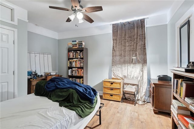 bedroom featuring ceiling fan and light hardwood / wood-style floors