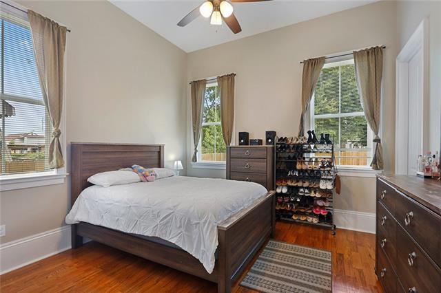 bedroom featuring lofted ceiling, ceiling fan, and dark hardwood / wood-style floors