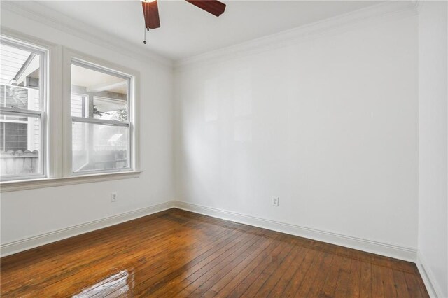 unfurnished room featuring ceiling fan, wood-type flooring, and ornamental molding