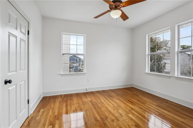 unfurnished bedroom with ceiling fan and light hardwood / wood-style floors