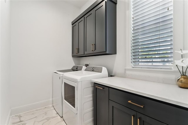 washroom with cabinets and separate washer and dryer