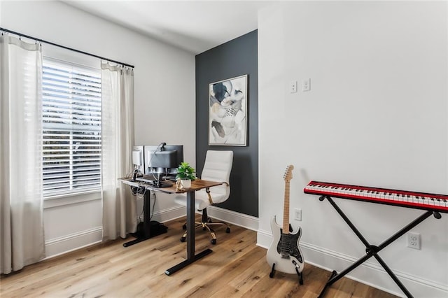 office with light wood-type flooring