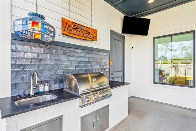 view of patio / terrace featuring area for grilling and sink