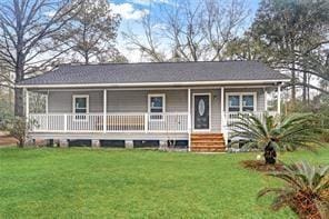 view of front of home with a front yard and covered porch