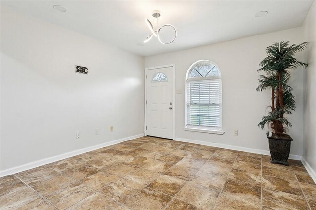 entrance foyer with a chandelier