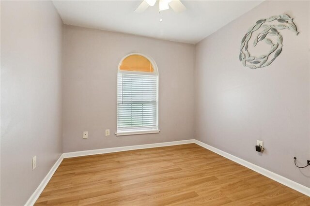 empty room featuring ceiling fan and light hardwood / wood-style flooring