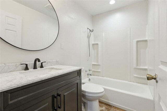 full bathroom featuring shower / bath combination, toilet, and vanity